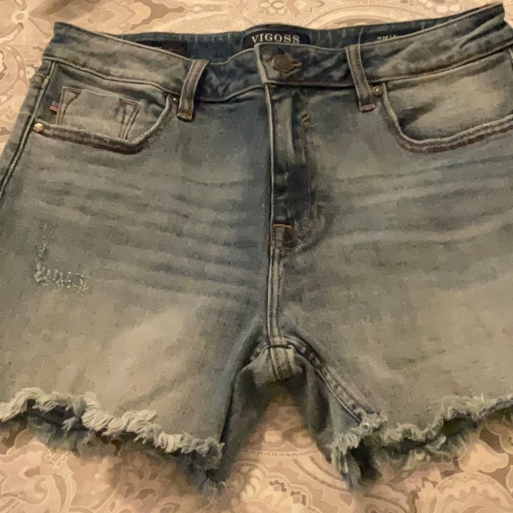 VIGOSS high waisted distressed jean shorts.